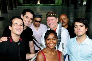 Magela Herrera with her flute among six fellow musicians